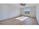 Bedroom with decorative wall trim, ceiling fan, and large window with backyard view at 180 Paislee Park (Lot #9 Paislee Park) Dr, Fayetteville, GA 30215
