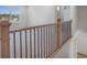 Second floor hallway with natural light, carpet flooring, and a view of neighborhood at 180 Paislee Park (Lot #9 Paislee Park) Dr, Fayetteville, GA 30215