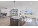 Modern kitchen with center island and pendant lighting at 180 Paislee Park (Lot #9 Paislee Park) Dr, Fayetteville, GA 30215