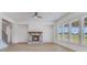 Spacious living room featuring a cozy fireplace and ample natural light at 180 Paislee Park (Lot #9 Paislee Park) Dr, Fayetteville, GA 30215