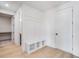Mudroom has white built-in bench with storage cubbies and a door leading to a bathroom at 180 Paislee Park (Lot #9 Paislee Park) Dr, Fayetteville, GA 30215