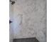 Walk-in shower boasts large marble tile surround and a sleek black shower head at 180 Paislee Park (Lot #9 Paislee Park) Dr, Fayetteville, GA 30215