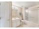 Bright bathroom featuring a shower, toilet, and sink with vanity at 15104 Harvest Ridge Ln, Alpharetta, GA 30022