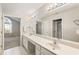 Bright bathroom features a double vanity with ample counter space and a large mirror at 15104 Harvest Ridge Ln, Alpharetta, GA 30022