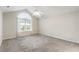 Bright bedroom with large window and neutral carpet at 15104 Harvest Ridge Ln, Alpharetta, GA 30022
