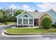 Charming blue house with a sunroom addition, brick accents, and a well-maintained lawn at 15104 Harvest Ridge Ln, Alpharetta, GA 30022