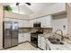 Full kitchen featuring stainless steel appliances and a breakfast bar at 15104 Harvest Ridge Ln, Alpharetta, GA 30022