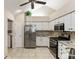 Well-lit kitchen featuring granite countertops, stainless steel appliances, and neutral backsplash at 15104 Harvest Ridge Ln, Alpharetta, GA 30022