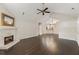Spacious living room with hardwood floors, a stone fireplace, and an open layout at 15104 Harvest Ridge Ln, Alpharetta, GA 30022