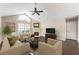 Inviting living room with fireplace, vaulted ceiling, neutral colors, and hardwood flooring at 15104 Harvest Ridge Ln, Alpharetta, GA 30022