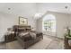 Comfortable bedroom with neutral colors, a ceiling fan, and natural light from the window at 15104 Harvest Ridge Ln, Alpharetta, GA 30022