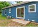 Backyard with a wood deck, sliding glass door, blue siding and lawn at 1924 Browns Mill Se Rd, Atlanta, GA 30315