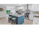 Modern kitchen featuring stainless appliances, a center island, and lots of natural light at 1924 Browns Mill Se Rd, Atlanta, GA 30315