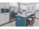 Modern kitchen featuring stainless appliances, white cabinets, and a center island with seating at 1924 Browns Mill Se Rd, Atlanta, GA 30315
