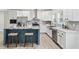 Modern kitchen with white cabinets, stainless appliances, and a stylish center island at 1924 Browns Mill Se Rd, Atlanta, GA 30315