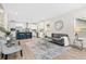 Bright and open-concept living room and kitchen featuring modern decor and appliances at 1924 Browns Mill Se Rd, Atlanta, GA 30315
