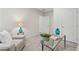 Bright office space features a comfortable sofa, glass desk, and natural lighting at 1924 Browns Mill Se Rd, Atlanta, GA 30315