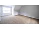 Bedroom featuring neutral paint, carpeted floors, and a sun-filled window at 4230 Waldrop Hills Ter, Decatur, GA 30034
