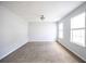Bedroom featuring neutral paint, carpeted floors, and a sun-filled double window at 4230 Waldrop Hills Ter, Decatur, GA 30034