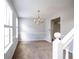 Dining room featuring carpeted floors and a decorative chandelier for inviting gatherings at 4230 Waldrop Hills Ter, Decatur, GA 30034