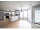 Open kitchen with white cabinets, breakfast bar, and seamless flow to dining area at 4230 Waldrop Hills Ter, Decatur, GA 30034
