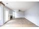 Bright living room featuring carpeted floors, fireplace, and a walk-out to the yard at 4230 Waldrop Hills Ter, Decatur, GA 30034