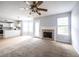 Cozy living room featuring carpeted floors, fireplace, and seamless open floorplan at 4230 Waldrop Hills Ter, Decatur, GA 30034