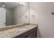 Bathroom with granite countertop and a walk-in shower at 4900 Kentwood Dr, Marietta, GA 30068