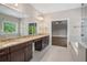 A primary bathroom with a long vanity and an entry into the bedroom suite at 4900 Kentwood Dr, Marietta, GA 30068