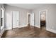 Bedroom featuring hardwood floors, white trim, and multiple doorways at 4900 Kentwood Dr, Marietta, GA 30068