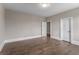 Large bedroom with hardwood floors and neutral paint at 4900 Kentwood Dr, Marietta, GA 30068