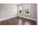 Bright bedroom with hardwood floors and natural light from the surrounding trees at 4900 Kentwood Dr, Marietta, GA 30068