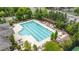 Aerial view of a large community pool with lounge chairs and a pergola at 4900 Kentwood Dr, Marietta, GA 30068