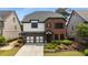 Beautiful two-story home with brick accents, two-car garage, and manicured landscaping at 4900 Kentwood Dr, Marietta, GA 30068