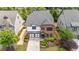 Charming two-story home with a two-car garage, tidy yard, and brick and siding accents at 4900 Kentwood Dr, Marietta, GA 30068