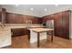 Elegant kitchen featuring dark wood cabinets, granite countertops, and stainless steel appliances at 4900 Kentwood Dr, Marietta, GA 30068