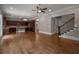 Open-concept living area with hardwood floors, adjacent to a gourmet kitchen and staircase at 4900 Kentwood Dr, Marietta, GA 30068