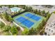 Aerial view of community tennis courts, pool, and well-maintained landscaping at 4900 Kentwood Dr, Marietta, GA 30068