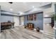 Finished basement featuring wood floors, neutral walls, and decor lighting creating a cozy and inviting space at 7505 Antique Barn Ave, Cumming, GA 30041