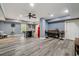 Basement featuring a modern bar area with bar stools, neutral walls, and modern ceiling lights at 7505 Antique Barn Ave, Cumming, GA 30041