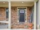 Elegant entryway with stone steps, a welcoming welcome sign, and beautiful accents at 7505 Antique Barn Ave, Cumming, GA 30041