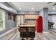 This kitchen features a wooden island with a butcher block top and retro red refrigerator at 7505 Antique Barn Ave, Cumming, GA 30041