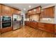 Gourmet kitchen with custom cabinetry, stainless steel appliances, and a stylish backsplash at 7505 Antique Barn Ave, Cumming, GA 30041