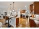 A kitchen featuring stainless steel appliances, granite countertops, wooden cabinets, and recessed lighting at 7505 Antique Barn Ave, Cumming, GA 30041