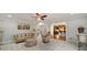 Inviting living room with plush seating, a ceiling fan, and open access to the kitchen area at 7505 Antique Barn Ave, Cumming, GA 30041