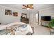 Spacious main bedroom with carpet, dresser, and television on stand creating a comfortable space at 7505 Antique Barn Ave, Cumming, GA 30041
