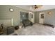 The covered patio has stone pavers and a ceiling fan that offers backyard ambiance and appeal at 7505 Antique Barn Ave, Cumming, GA 30041