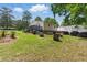Expansive backyard features a deck, patio, and seating area for outdoor enjoyment at 8136 Connally Dr, Douglasville, GA 30134