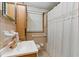Traditional bathroom featuring a sink, toilet, shower with curtain and window at 8136 Connally Dr, Douglasville, GA 30134