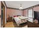 Bedroom with hardwood floors, a window and single bed at 8136 Connally Dr, Douglasville, GA 30134